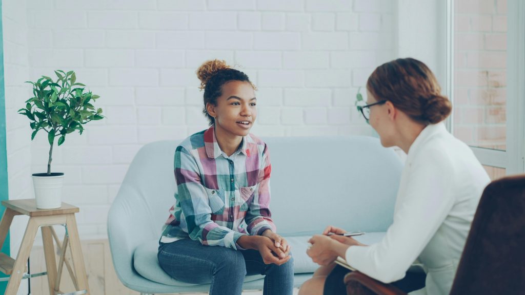 pexels photo 36729377 36729377 Teenager and therapist in a calm counseling environment.